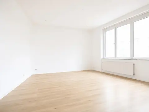 Before: Empty living room, furnished in three edits