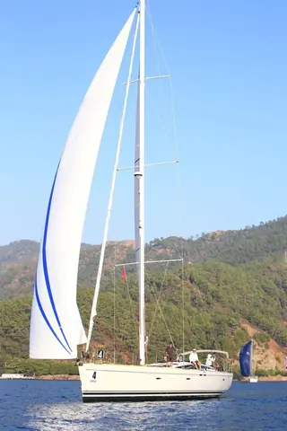 Before: Crimson stripes added to the sails