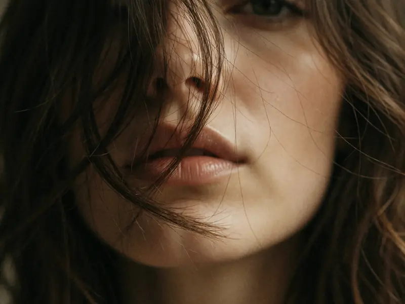 Krea 2 Turbo: Film close-up behind tousled hair